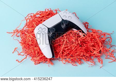 Videogame Console Wireless Gamepad. Blue Background. Minimal Style. Modern Leisure At Home.