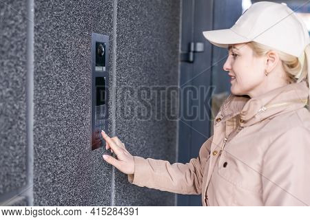 Stunning Face. Intercom, Interphone. Young Cheerful Fashionable Woman During Walking On Street. Fema