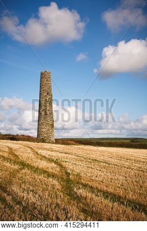 A Ruined Chimney Stands Isolated In The Landscape Of Cornwall, Uk