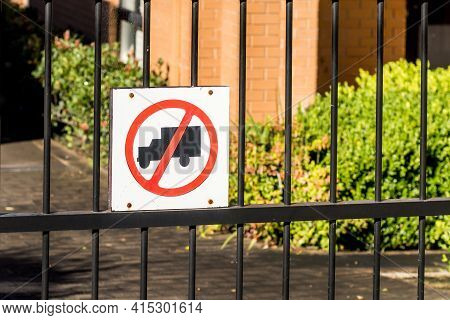No Truck Sign On A Metal Fence Of Residential Buildings Area