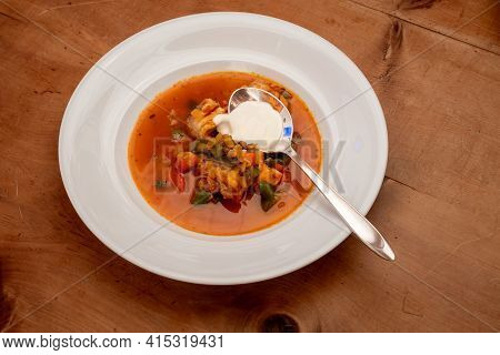Halaszle, Hungarian Fishermans Soup Or Fish Stew With Carp, Bell Peppers, Paprika And Sour Cream
