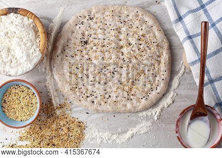 Homemade Turkish Flat Bread Known As Ramazan Pidesi, Tirnak Pidesi Or Pide. A Hand Rolled Rounded Fl