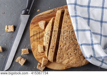 Flat Lay Image Of Turkish Flat Bread Known As Pide Or Pita On Wooden Chopping Board. The Wholegrain 