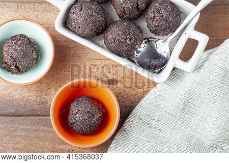 Flat Lay Image Of Sweet Brown Cake Balls. Baked In The Oven And Are Dipped In To Stump Or Syrup And 