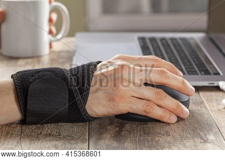 Chronic Trauma To The Wrist Joint  In People Using Computer Mouse May Lead To Disorders That Cause I