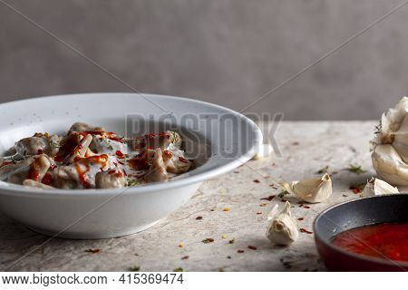 Traditional Turkish Manti Is A Form Of Dumpling Made With Ground Meat And Served In Garlic Yogurt An