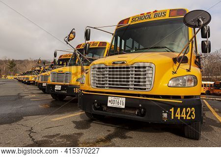 Bethesda, Md, Usa 12-21-2020: Close Up Selective Focus Frontal View Of A School Bus Fleet At A Parki