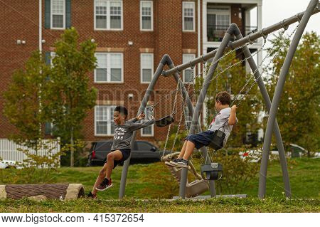 Montgomery County, Md, Usa 09/26/2020: An African American And A Caucasian Boy Are Playing Together 