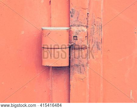 Safety Anti Thef Latch Lock On Warehouse Door. Industrial Kind Of Gate Door With Obsolete Red Paint.