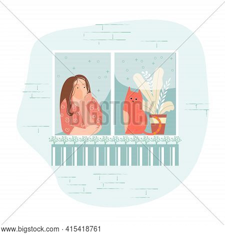 A Girl With A Cat Looks Out Of The Window. She Is Bored, Dreaming, Or Waiting.
