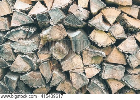 Old Wooden Pile Prepared For Winter. Fuel For Countryside Fireplace. Forest Timber Energy Concept, T