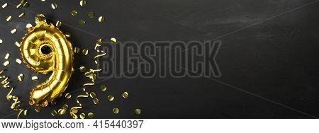 Gold Foil Balloon Number Nine Or Ninth. Birthday Greeting Card With The Inscription 9. Black Concret