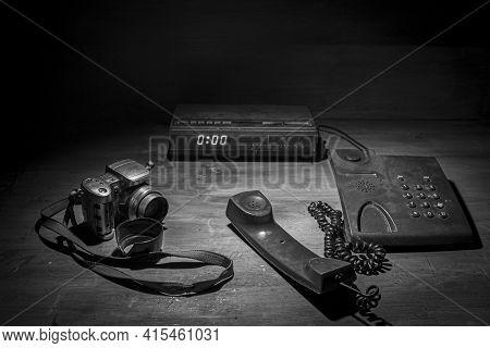 Black And White Retro,vintage Photograph Of A Radio Next To An Old Camera And Phone.old Camera.old R