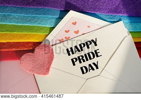 An Open Envelope With The Text Heppy Pride Day, On A Pink And Blue Background With A Decor Of Felt H