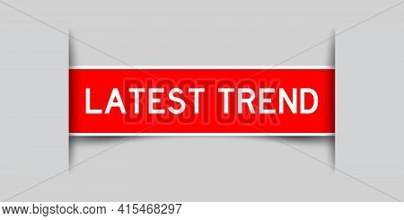 Inserted Red Color Label Sticker With Word Latest Trend On Gray Background