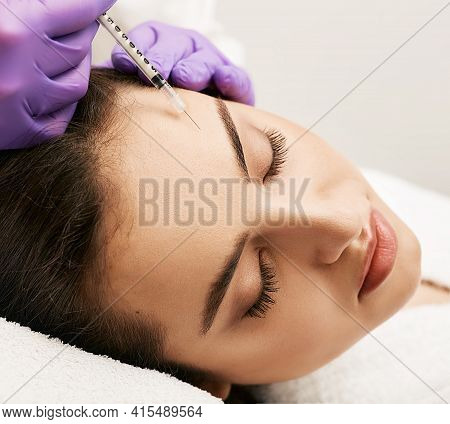 Injections In Woman Forehead Wrinkles, Blocking Mimic Wrinkles Using Beauty Injections At Aesthetic 