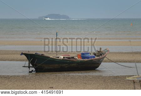 Fisherman's Fishing Boat On Sand At A Fishing Village Beach There Is An Island And Sea Background Wi