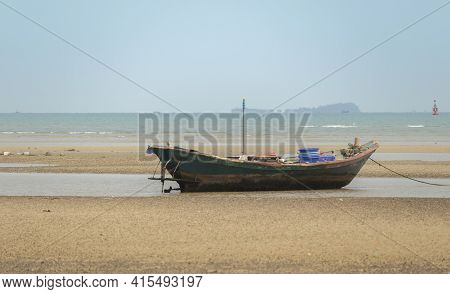 Fisherman's Fishing Boat On Sand At A Fishing Village Beach There Is An Island And Sea Background Wi