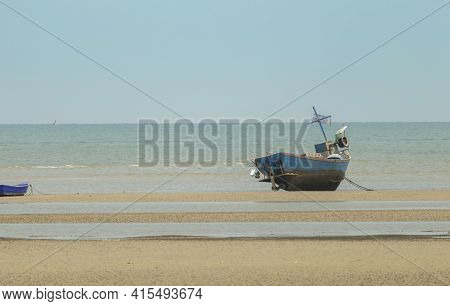 Fisherman's Fishing Boat On Sand At A Fishing Village Beach There Is An Island And Sea Background Wi