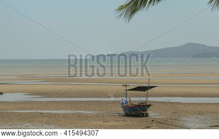 Fisherman's Fishing Boat On Sand At A Fishing Village Beach There Is An Island And Sea Background Wi