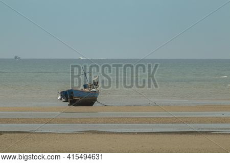Fisherman's Fishing Boat On Sand At A Fishing Village Beach There Is An Island And Sea Background Wi