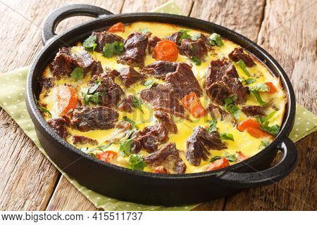 Balsica Tava Spicy Beef With Vegetables Baked With Eggs, Sour Cream And Milk Close-up In A Frying Pa