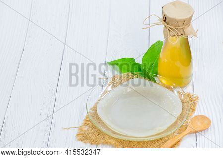 Scoby On Dish And Kombucha Tea On Wood Background, Cider Fermented Drink. Benefits Of Kombucha Tea A