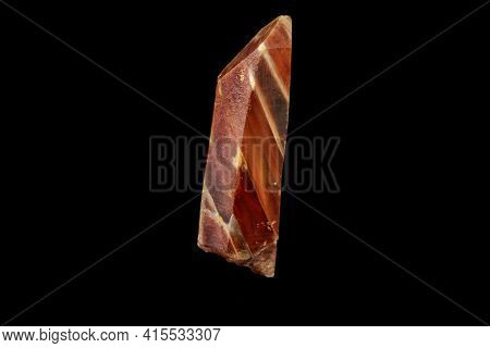 Macro Of A Mineral Quartz Stone With Lepidokrokit On A Black Background