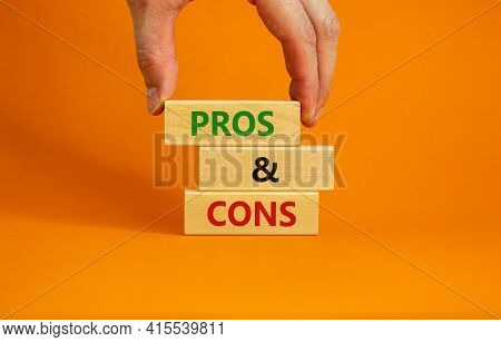 Pros And Cons Symbol. Wooden Blocks With Words 'pros And Cons'. Beautiful Orange Background, Busines