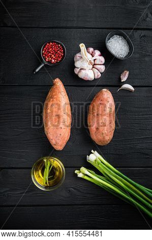 Sweet Potato Or Batat  With Ingredients, On Black Wooden Background, Top View.