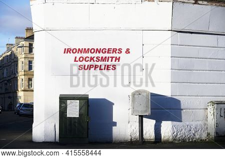 Ironmongers And Locksmith Supplies Sign On Wall