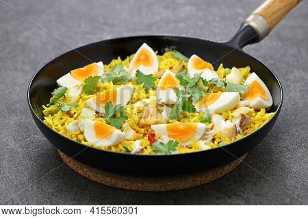 Kedgeree; spice rice with smoked haddock nad boiled eggs, homemade english breakfast