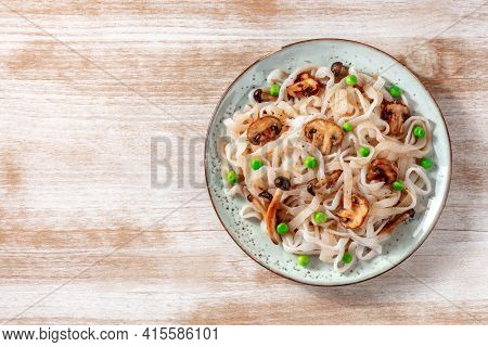 Konjac Pasta With Mushrooms And Green Peas, Shot From The Top