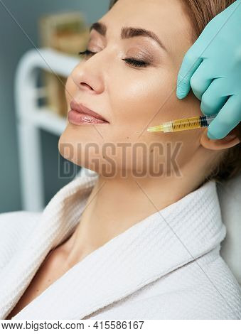 Adult Woman While Face Plasmolifting At A Beauty Clinic. Cosmetology Procedure For Anti-aging Effect