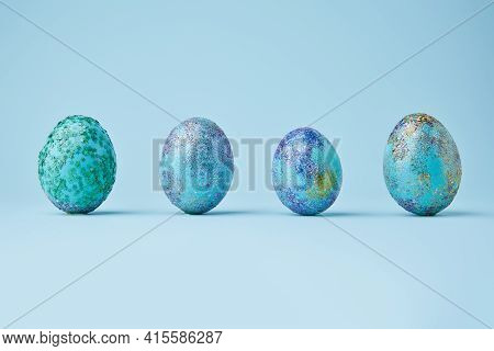 Blue Painted Eggs With Bright Shiny Gliter On Blue Background