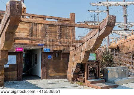 Seocheon, South Korea; March 23, 2021: Public Restrooms In Bottom Of Replica 14th Century Korean Sai