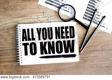 All You Need To Know Concept. Text On White Paper On Wood Background