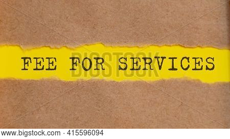 Fee For Services Text Written Under On Torn Paper.