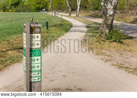 Salland, Netherlands - April 27, 2020: Direction Sign For Bicycle Tracks In National Park Sallandse 