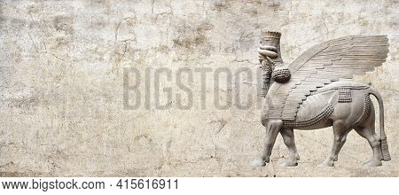 Grunge background with stone texture and lamassu - human-headed winged bull statue, Assyrian protective deity. Copy space for text. Mock up template