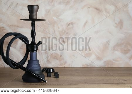 Traditional Hookah On Wooden Table. Space For Text