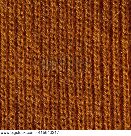 Mustard - Colored Wool Knit Fabric Close-up. Hobbies And Manual Work.