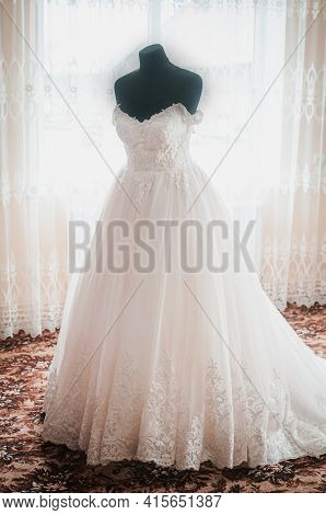 White Wedding Dress On The Black Dummy