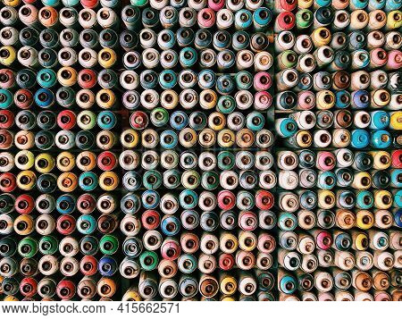 Bright Vivid Top Shot Of Assorted Spray Paint Aluminium Cans. Wall Made Of Multiple Different Color 