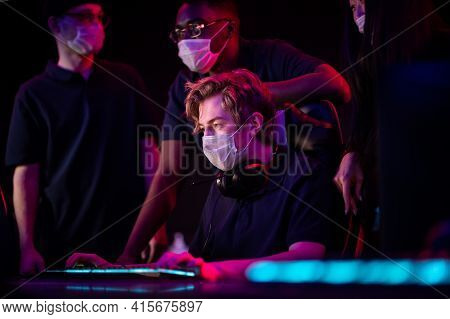 Young Guys In Medical Masks Play In A Computer Club During The Covid-19 Pandemic