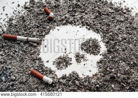 Stylized Image Of A Human Skull Using Tobacco Ash And Cigarette Butts. Cigarette Butts On Tobacco As