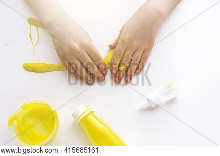 Kid Plays With Homemade Yellow Slime. Child Hands Stretch Slime Toy. Make Slime At Home. Diy And Chi