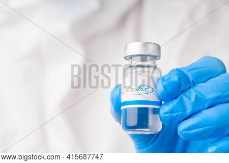 Curevac Vial Or Bottle For Injection With Pharmaceuticals Or Drugs In Scientist Hands In Rubber Glov