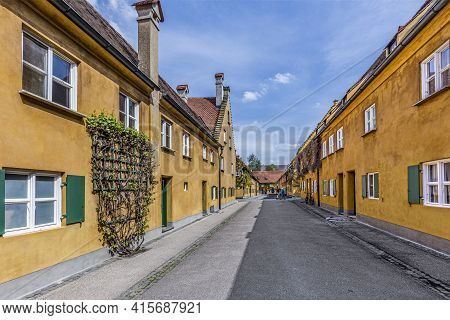 Augsburg, Germany - April 29, 2015: Sthe Fuggerei Is The Worlds Oldest Social Housing Complex Still 
