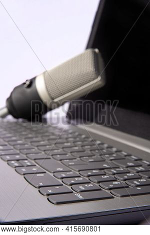 Home Work, Professional Condenser Microphone And Computer On Light Background, Selective Focus.